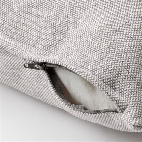 Detailný záber materiálu poťahu kočíka s textúrou pripomínajúcou riflovinu