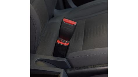 Detail 5-bodového bezpečnostného pásu s kontrolkou správneho dotiahnutia.